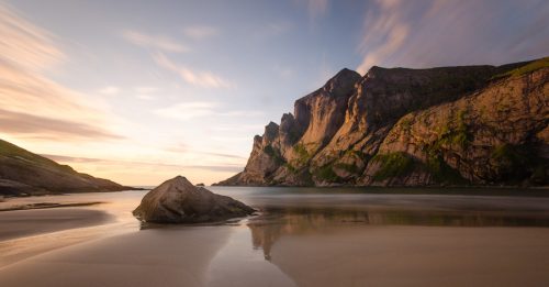 Chromebook background features a beach and ocean with nature wallpaper.